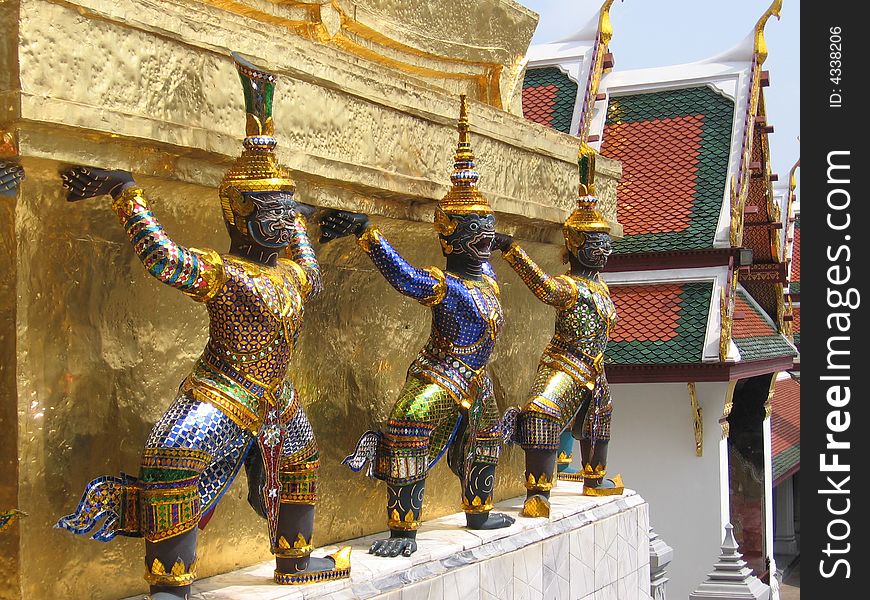 Ornate characters as part of Buddhist temple architecture in Bangkok, Thailand. Ornate characters as part of Buddhist temple architecture in Bangkok, Thailand