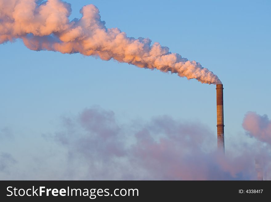 Smoking tubes with blue sky pink sunrise. Smoking tubes with blue sky pink sunrise