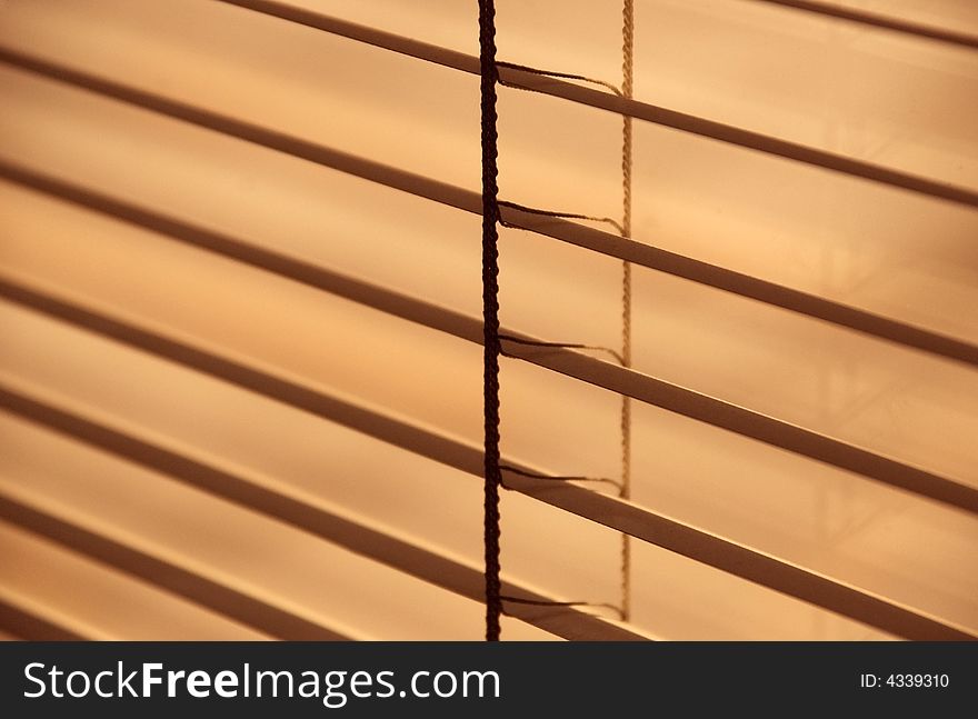 Detail image of metal blinds on a sunny day. Detail image of metal blinds on a sunny day