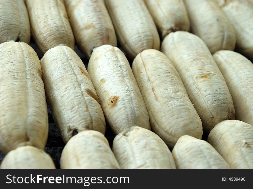 A bunch of bananas being grilled. A bunch of bananas being grilled