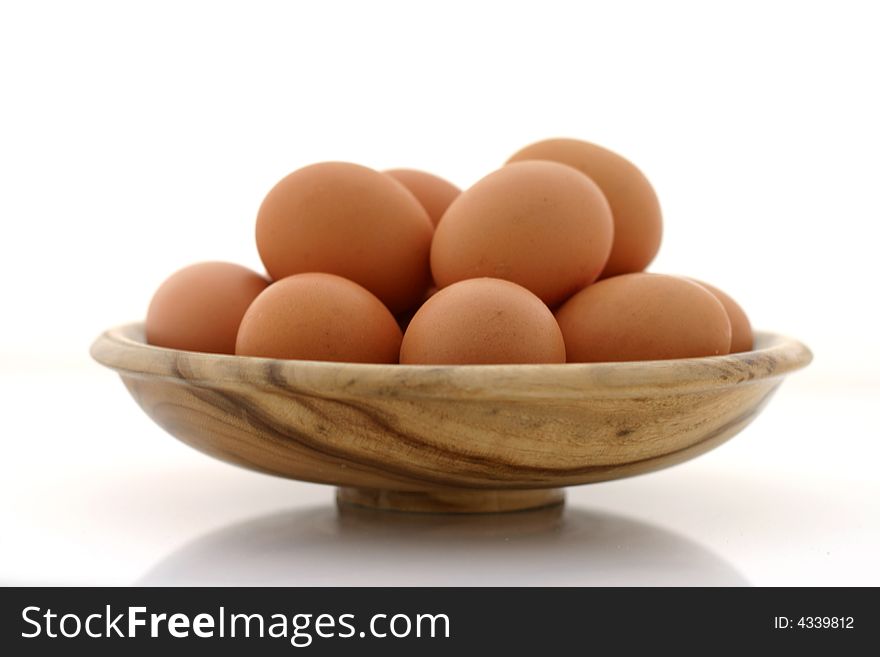 Brown eggs on white background