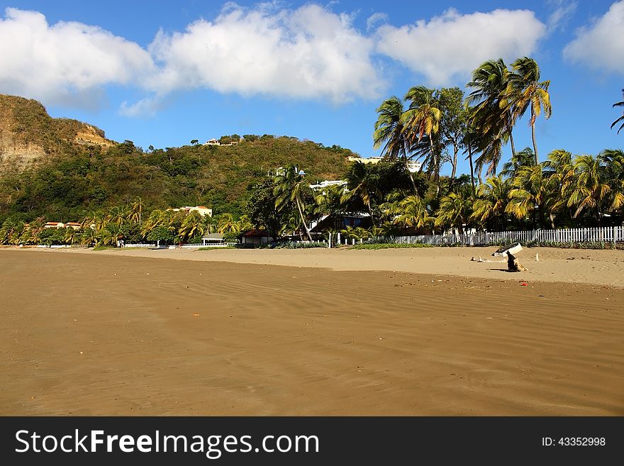 Wet and dry sand at the wide tropical beach landscape. Wet and dry sand at the wide tropical beach landscape