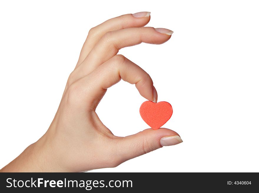 Female hand holding little red heart.Isolated on white background.
