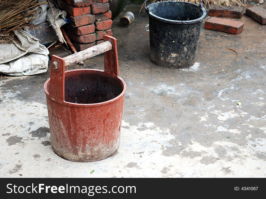 There are two tubs for storing water in a small village in China. There are two tubs for storing water in a small village in China.