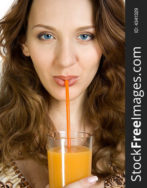 Attractive brunette drink orange juice. Isolate on white. Attractive brunette drink orange juice. Isolate on white.