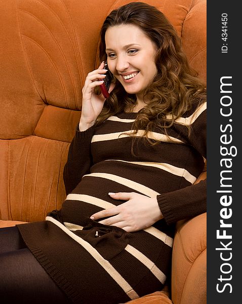 Beauty pregnant women talking at mobile phone