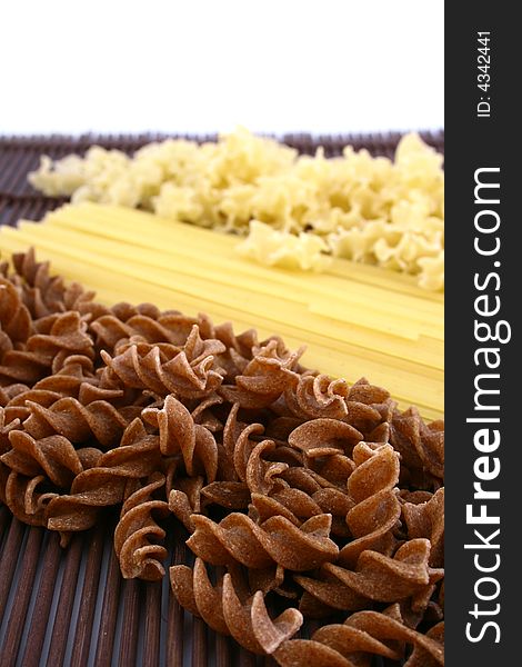 Assorted pasta still life over white background