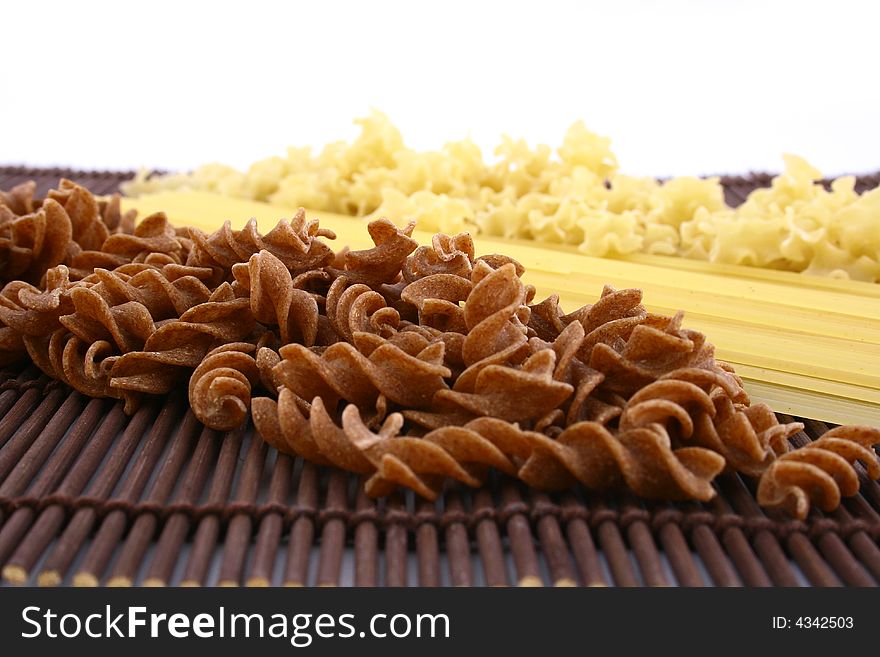 Assorted pasta still life over white background