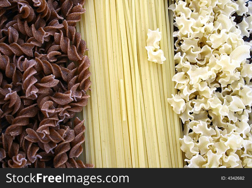 Assorted pasta still life over white background