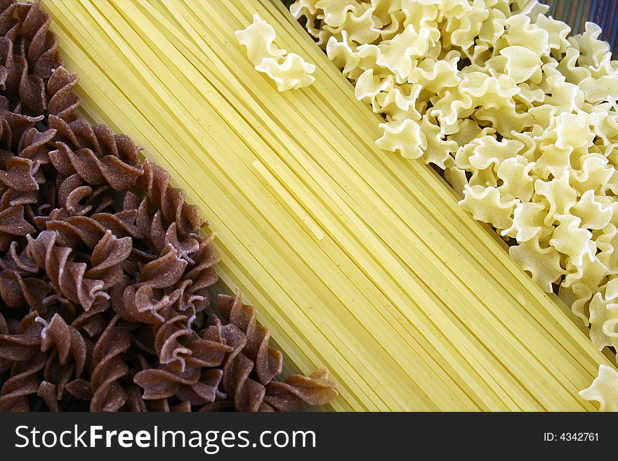 Assorted pasta still life over white background