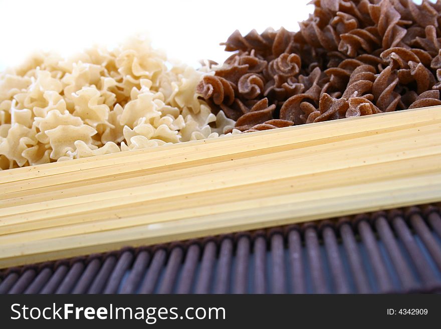 Assorted pasta still life over white background