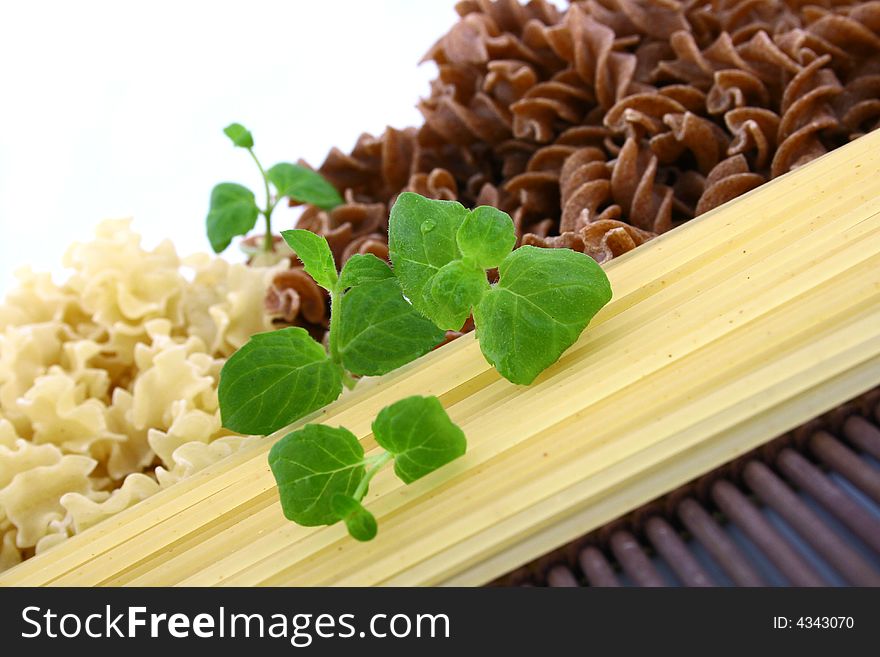 Assorted pasta still life over white background