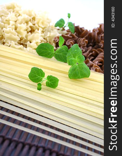 Assorted pasta still life over white background