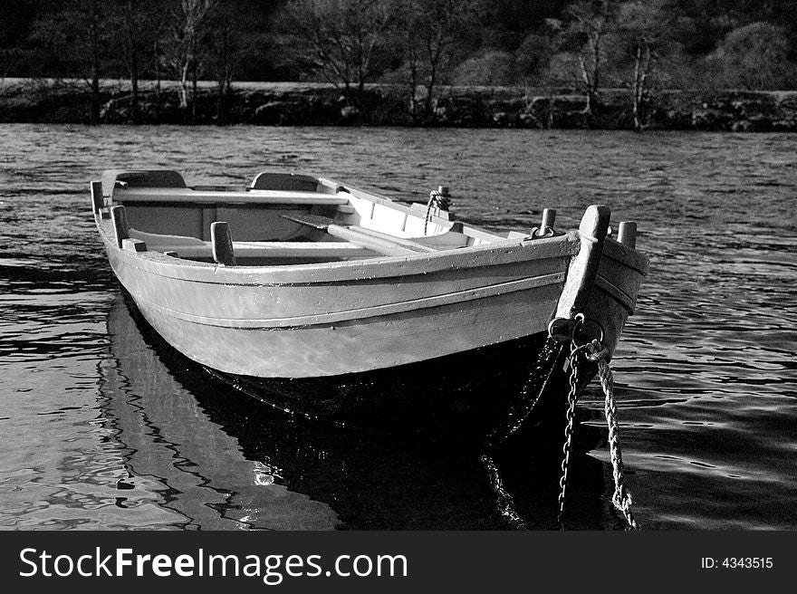 River Boat photographed on the River Tummel. Black and white and shot on a high ISO to add grain