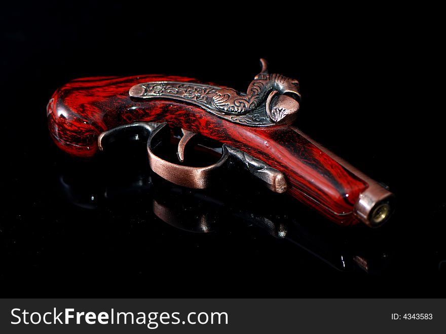 An old hand gun，with red。