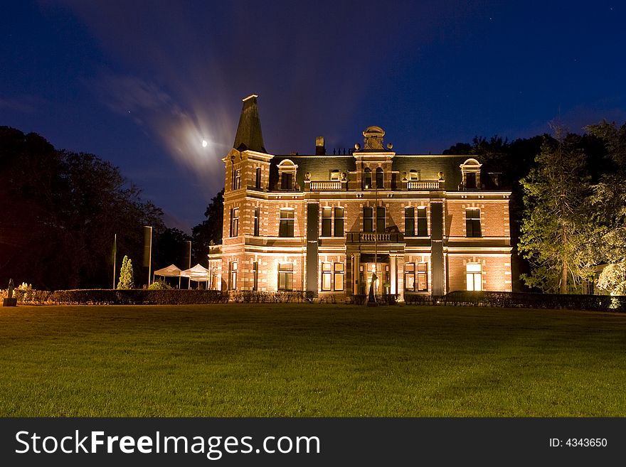 An old building lit by moonlight. An old building lit by moonlight