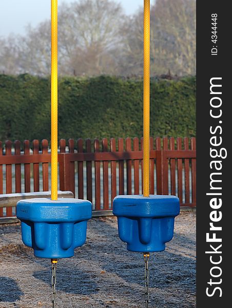 Childrens playground obstacles covered in frost