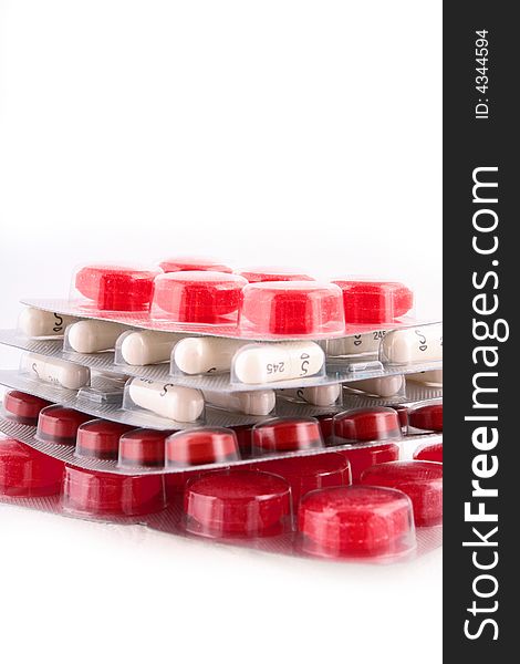 A red pile of medicines. A red pile of medicines