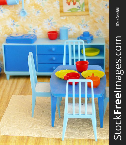 Nip bottle of table with three chairs in eating room. Nip bottle of table with three chairs in eating room