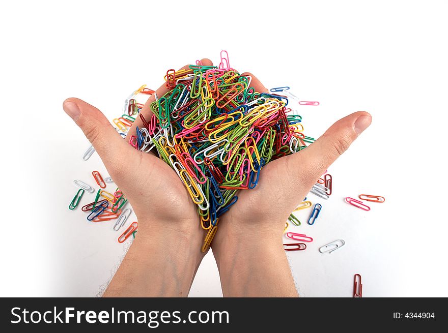 Hands full of paper clips isolated on white 2. Hands full of paper clips isolated on white 2