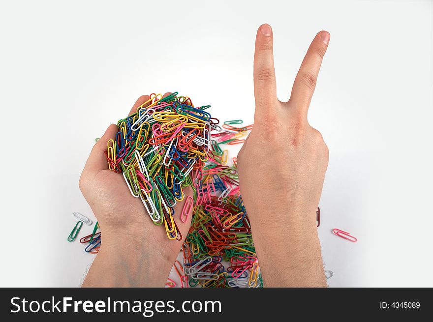 Hands holds paper clips and gives gesture 5