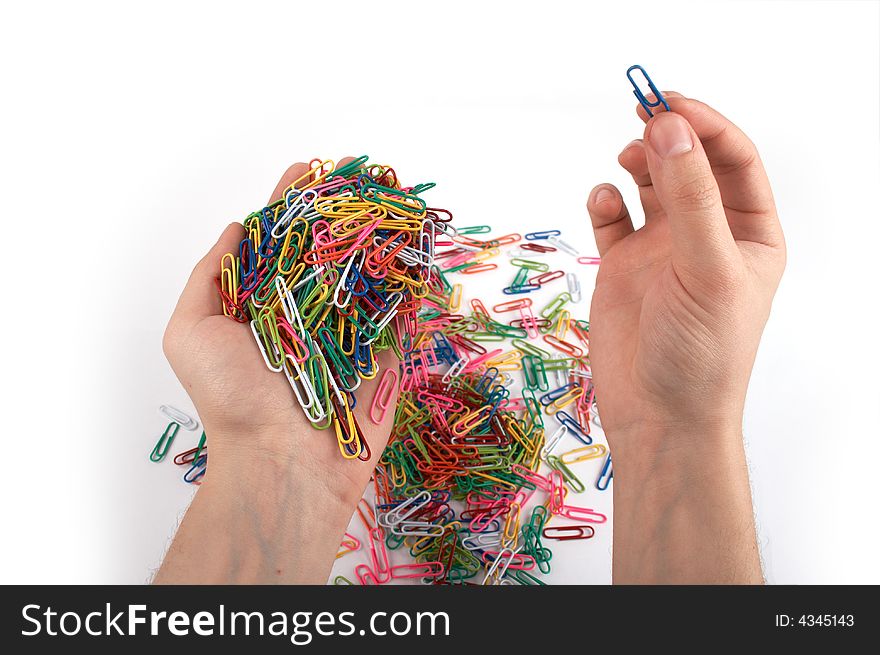 Hands holds paper clips isolated on white