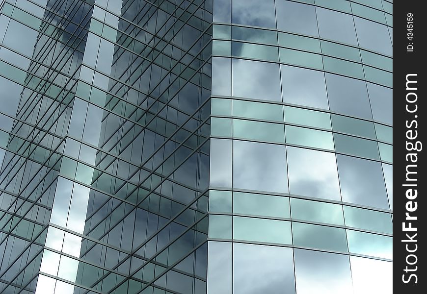 Clouds reflecting in the glass of an urban skyscraper. Clouds reflecting in the glass of an urban skyscraper.