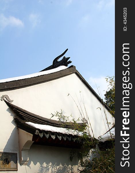 One side of a house with the decoration of bamboos' shadow.This picture is taken in Hanshan Temple in Suzhou ,China.