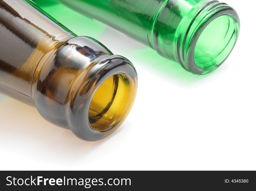 Brown and green bottles in white background