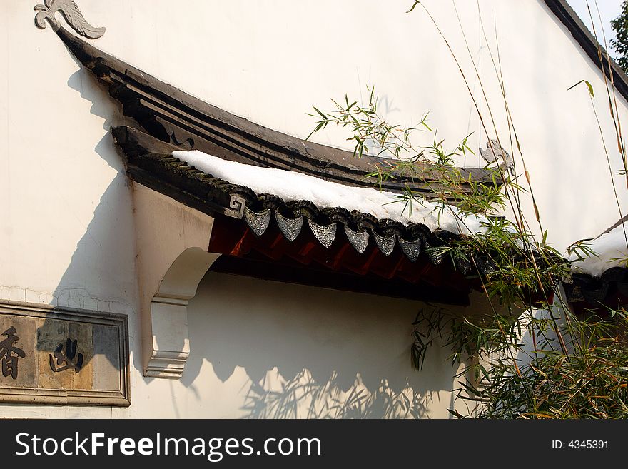 One side of a house with the decoration of bamboos' shadow.This picture is taken in Hanshan Temple in Suzhou ,China.
