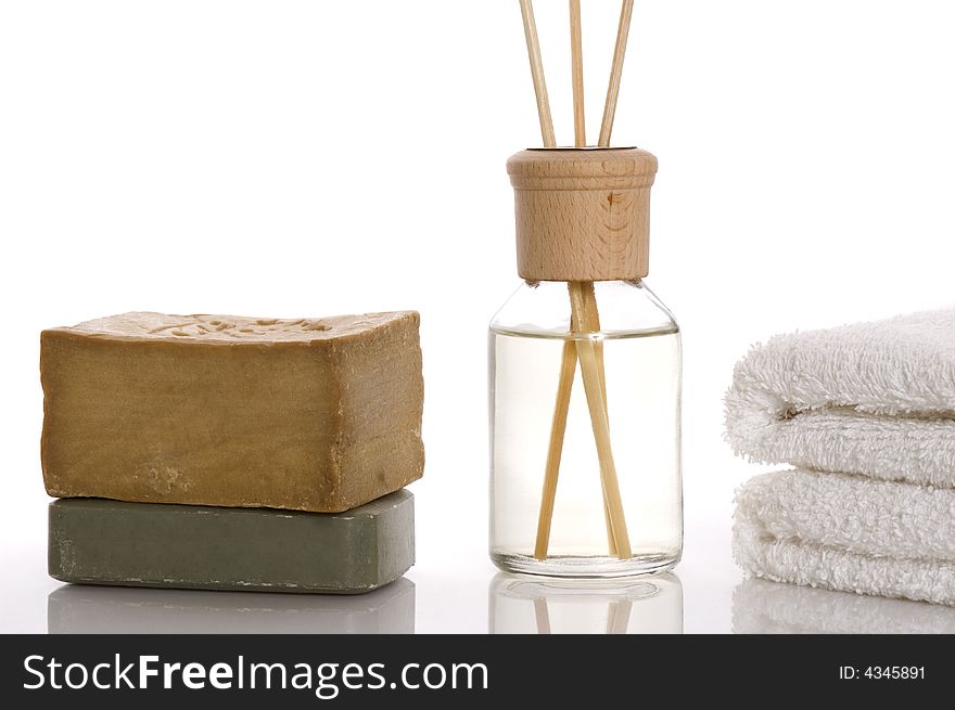 Aroma therapy objects. bottle of esential oil, towels, soap