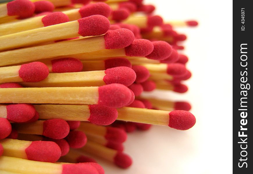 A close up of pile of red-tipped cooks matches