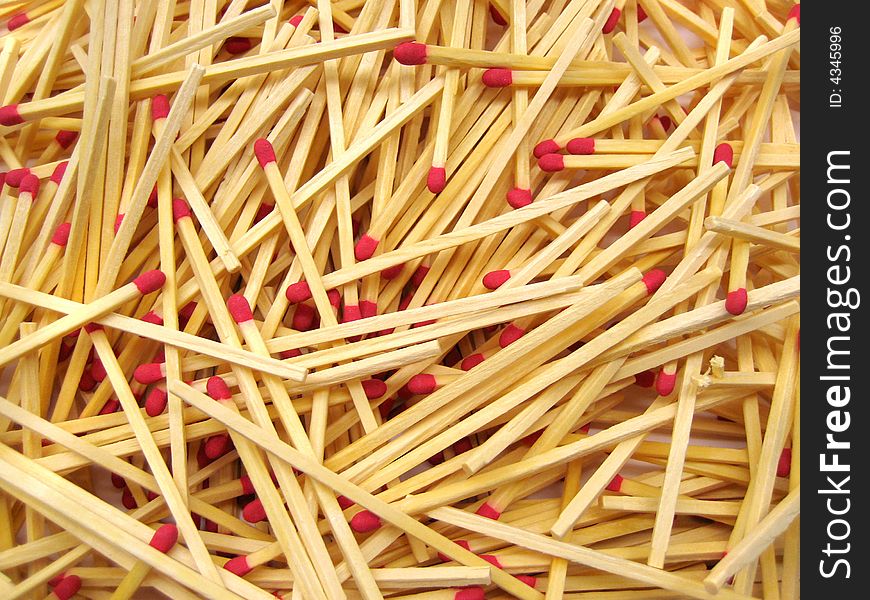 A scattered pile of red-tipped cooks matches