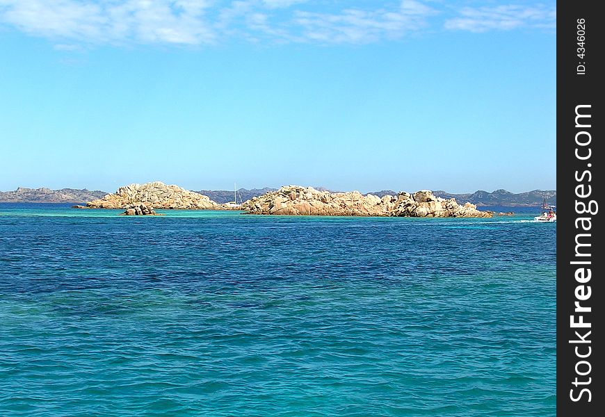 Sardinia incredibly blue sea, a shot from a boeat through the little islands. Sardinia incredibly blue sea, a shot from a boeat through the little islands.