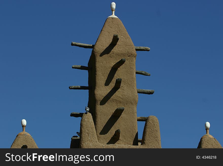 Minarets of a traditional mosk made of mud in Mali, West Africa. Minarets of a traditional mosk made of mud in Mali, West Africa