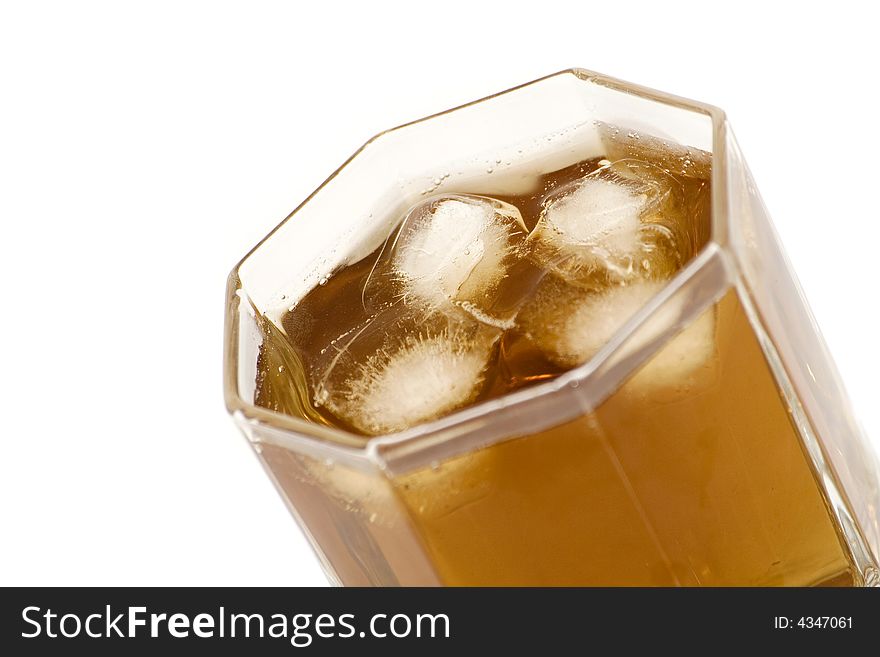 Alcohol and ice in glass