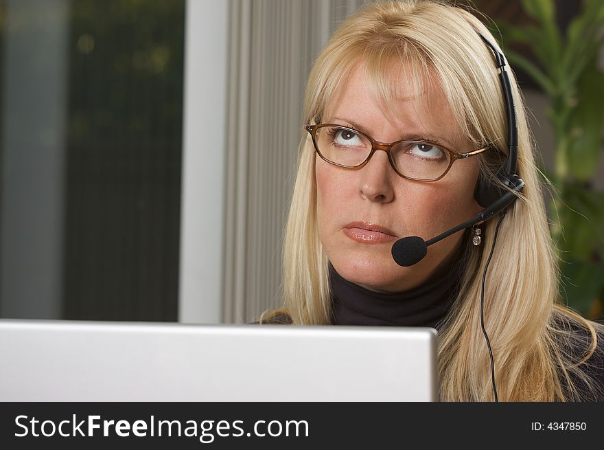 Attractive Businesswoman With Phone Headset