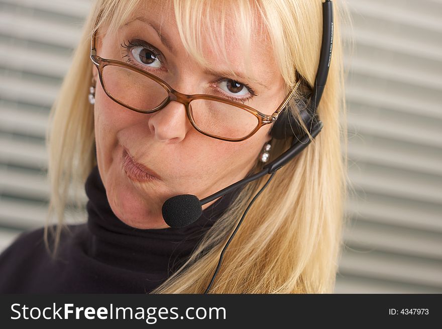 Attractive Businesswoman With Phone Headset