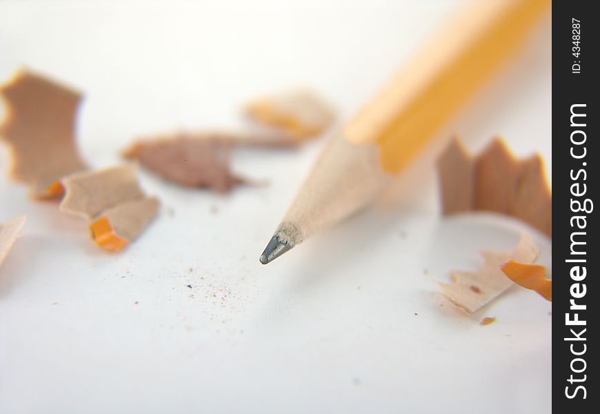 Yellow number two pencil with shavings isolated on white background