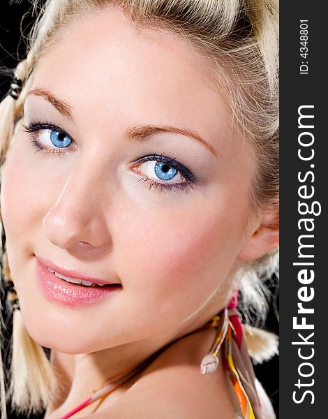 A smile of a caucasian blue eyes blond girl. A smile of a caucasian blue eyes blond girl