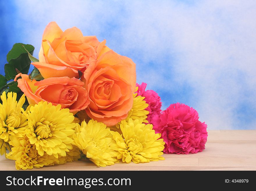 Flower Bouquet on Table With Blue Textured Background. Flower Bouquet on Table With Blue Textured Background
