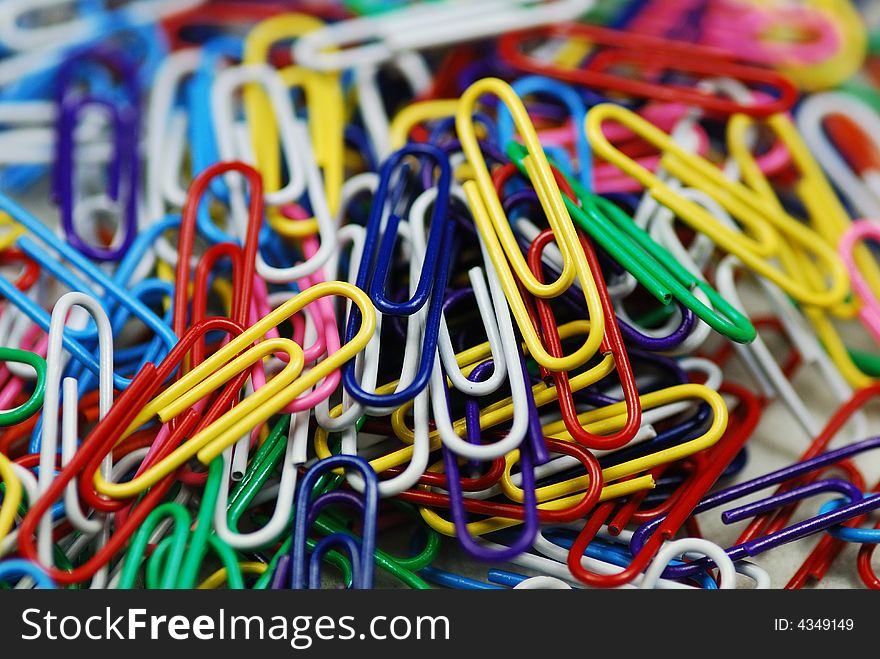 A bunch of colorful paper clips close up