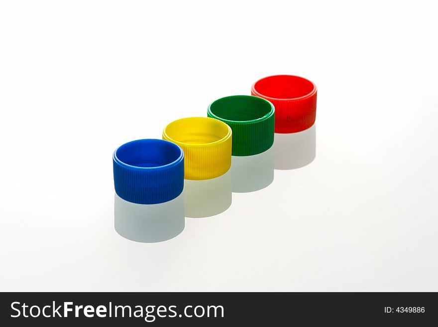 An arrangement of bottle caps in various positions. An arrangement of bottle caps in various positions