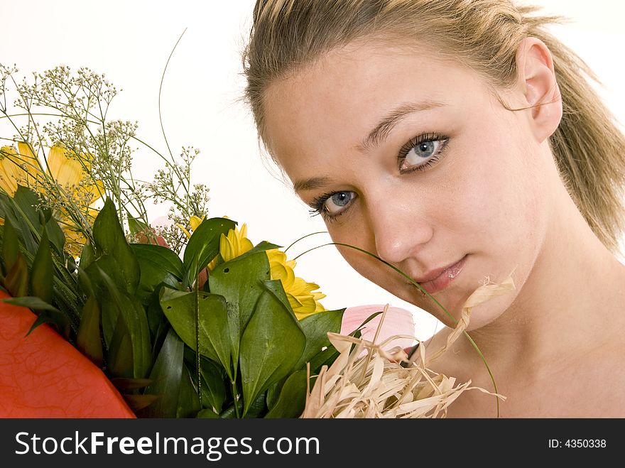 Young girl holding her flowers. Young girl holding her flowers