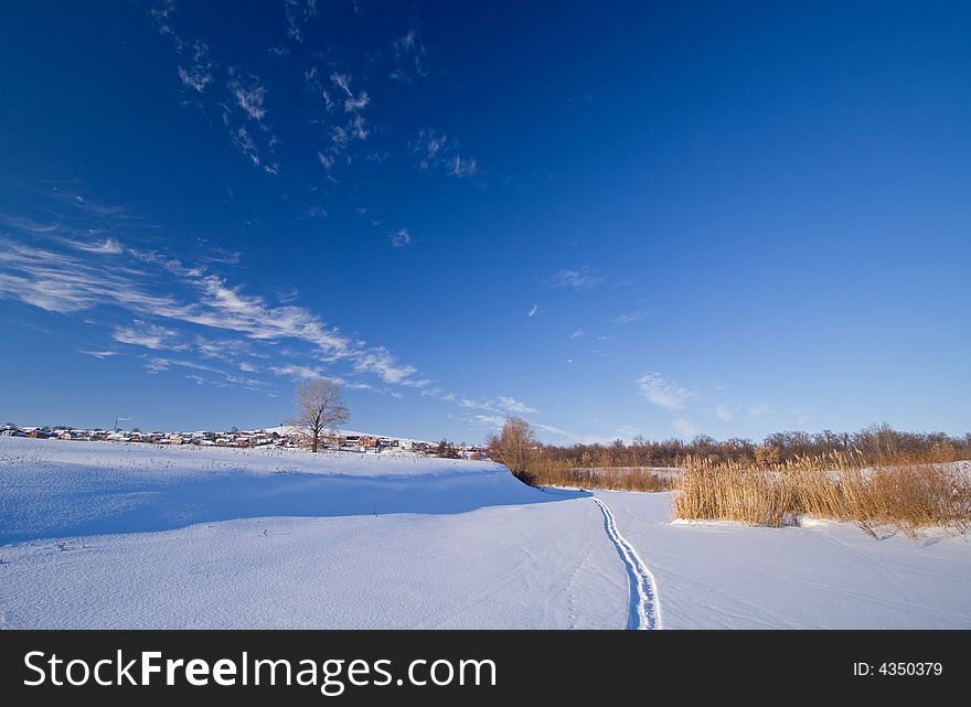 Nature ski ski-track sky snow sunny winter, field, frozen river, dry grass. Nature ski ski-track sky snow sunny winter, field, frozen river, dry grass