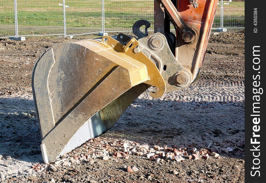 The shovel of a excavator at a building lot in ratingen, germany. The shovel of a excavator at a building lot in ratingen, germany