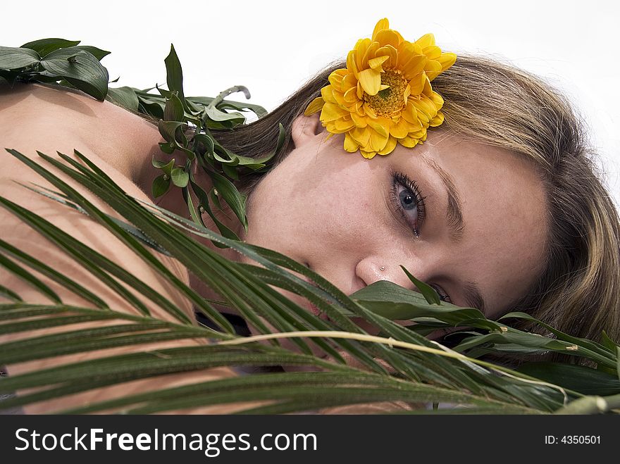 Girl relaxing covered with leaves. Girl relaxing covered with leaves