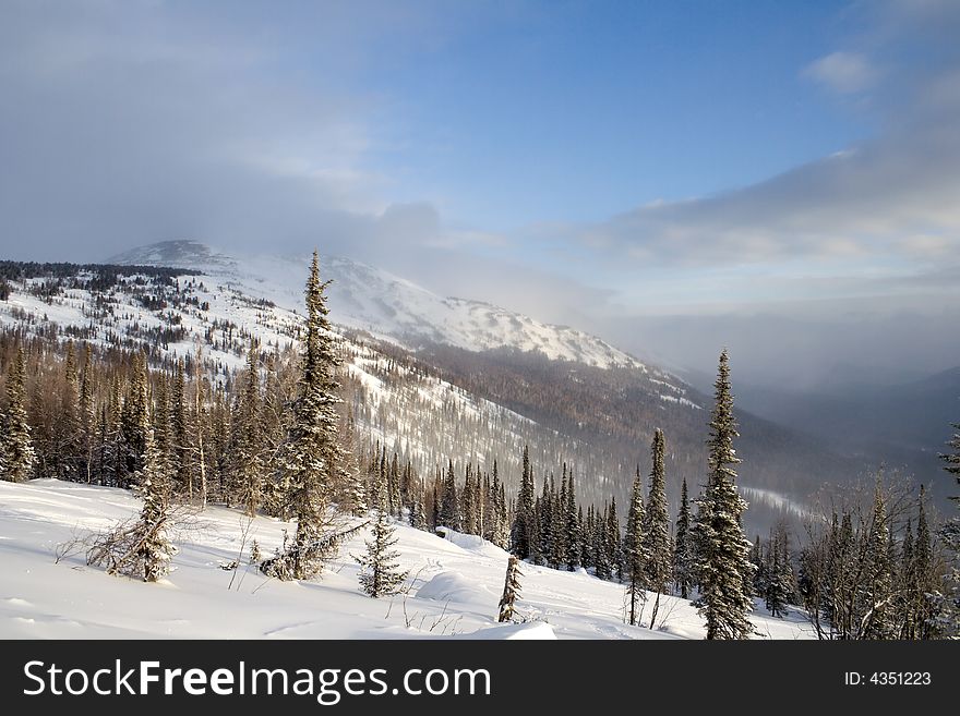 Alpine slope covered with snow