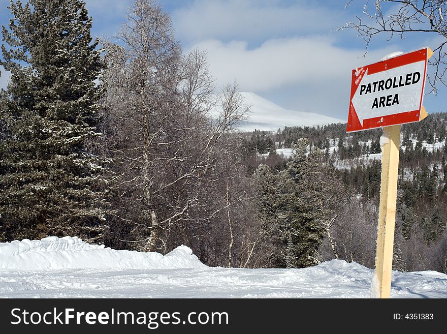 Sign patrolled area on mountain slope for ski and snowboarding freeride. Sign patrolled area on mountain slope for ski and snowboarding freeride