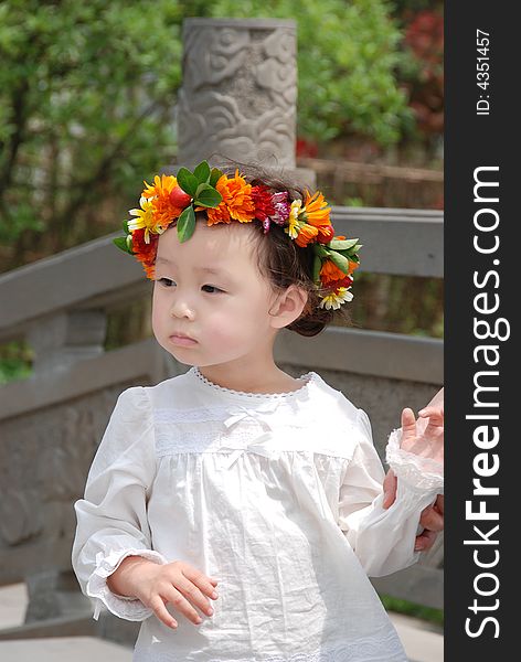 Beautiful Child With A Coronet Of Flowers
